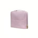 Violet makeup bag with a gold clasp on a white background