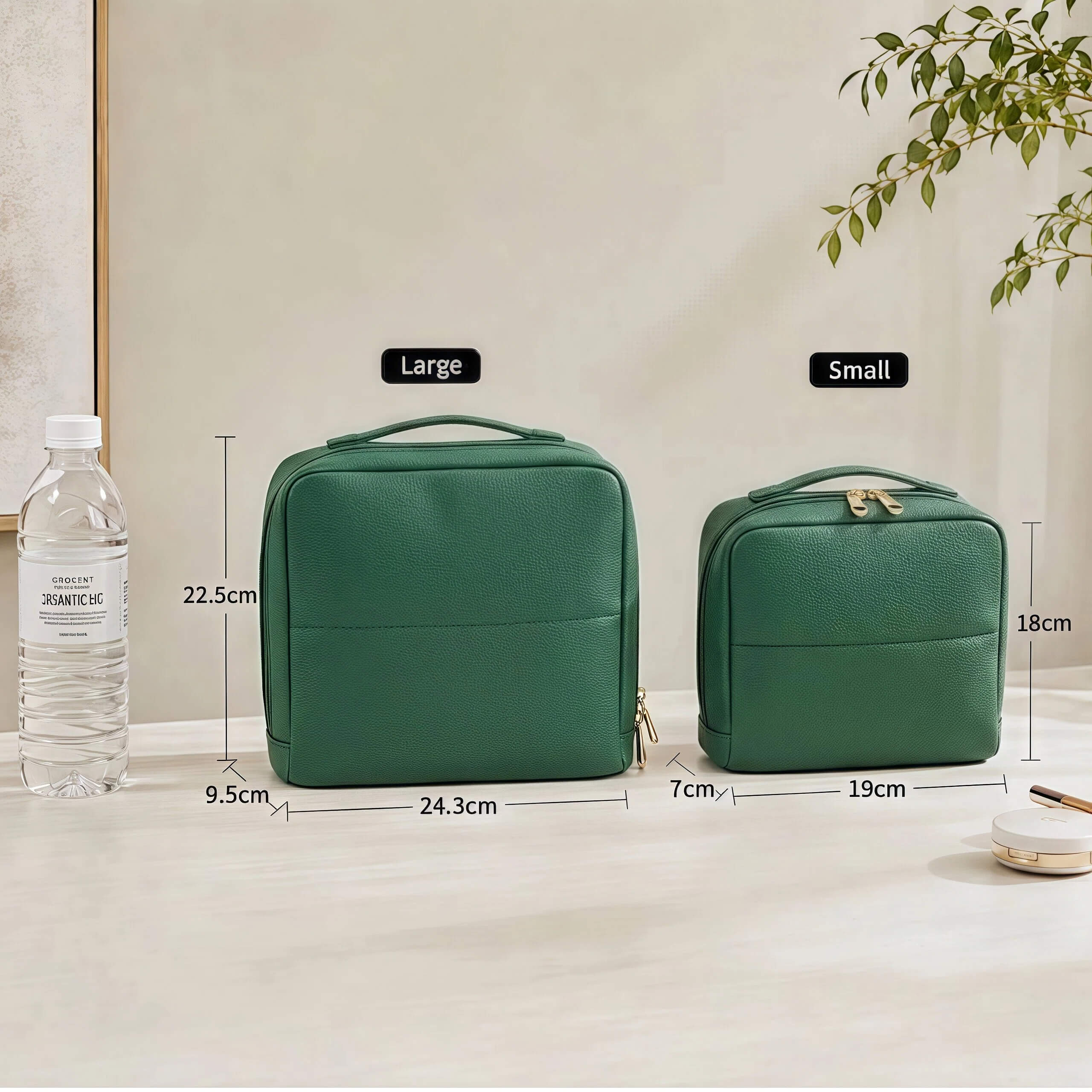 Two green standing makeup bags with measurements and a water bottle on a light surface.