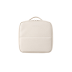 A cream-colored faux leather travel pouch with a top handle, shown from a front-facing perspective on a solid white background.