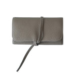 Olive grey leather jewellery bag with strap on a white background