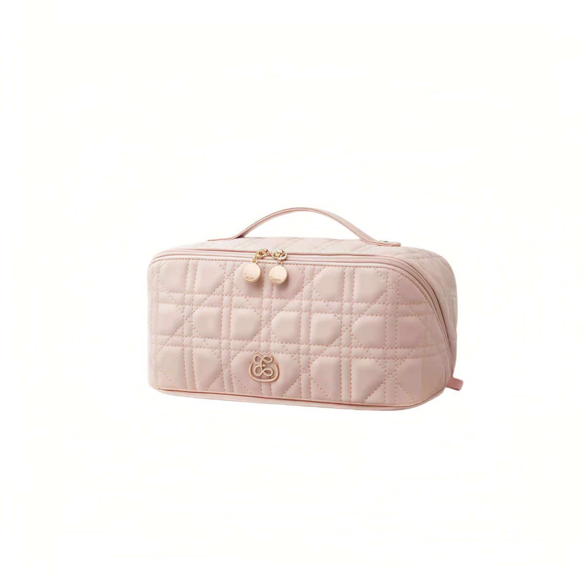 A light pink quilted cosmetic bag with a top handle, gold-tone zipper, and a small bear logo on the front, shown on a plain white background.