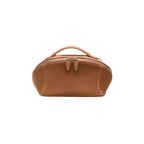 A brown cosmetic bag with a top handle, zippered closure, and decorative front tab details, shown against a plain white background.
