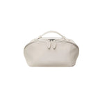 A cream cosmetic bag with a top handle, zippered closure, and decorative pull tabs, shown against a plain white background.