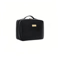 Black cosmetic bag with a gold tag on a white background