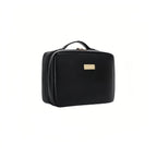 Black cosmetic bag with a gold tag on a white background