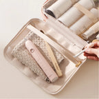 Set of cleaning tools including brushes and a squeegee in a beige carrying case on a light background.