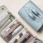 A blue makeup bag with another bag opened on the side