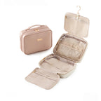 Pink toiletry bag  with open compartments on a white background
