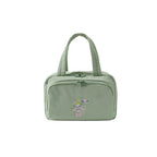 Green travel bag on a white background