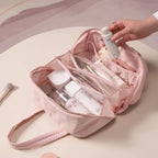 Pink cosmetic bag with skincare products on a light pink background
