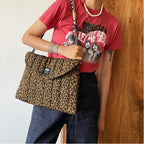 Gesteppte Laptoptasche mit Leopardenmuster