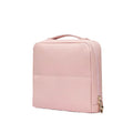 Pink makeup bag with a gold zipper on a white background
