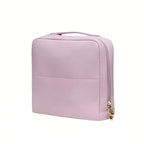 Violet upright makeup bag with a gold zipper on a white background
