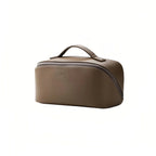 Olive grey toiletry bag on a white background