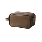 Brown dual-zip toiletry bag on a white background