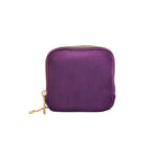 Purple velvet jewellery pouch on a white background