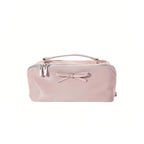 Voilet cosmetic bag with a bow on a white background