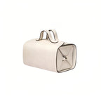 Beige makeup bag with a handle on a white background