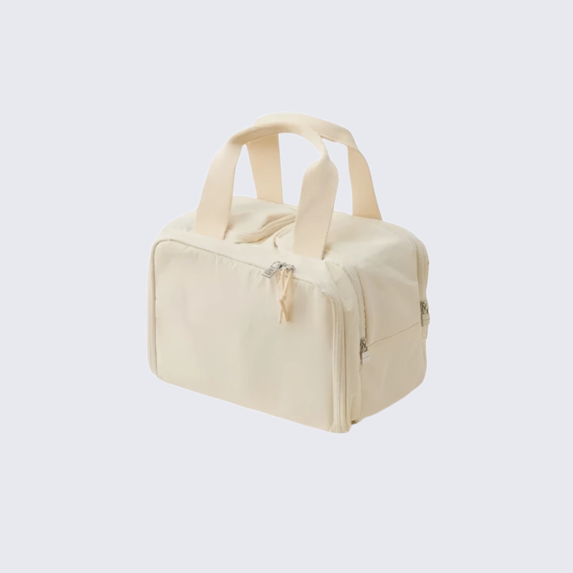 Beige toiletry bag with handles on a light gray background