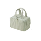 Light green travel bag with handles on a white background