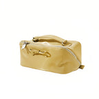 Yellow cosmetic bag with a bow detail on a white background
