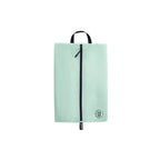 Light green shoe bag with a black zipper on a white background