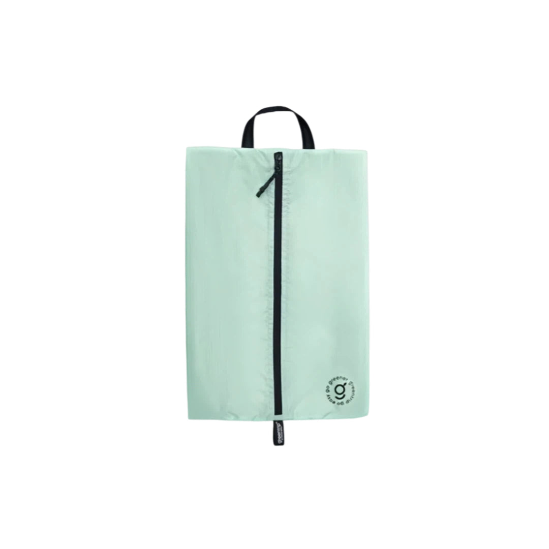 Light green shoe bag with a black zipper on a white background