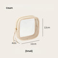 Cream-colored square cosmetic bag with dimensions on a beige background