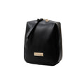 Black makeup bag with a gold tag on a white background