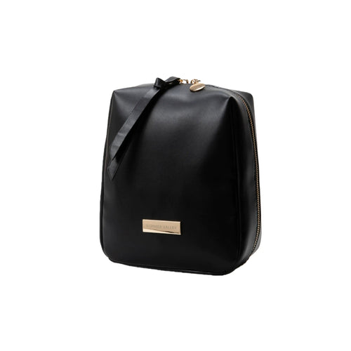Black makeup bag with a gold tag on a white background