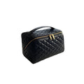 Black cosmetic bag with gold zipper on a white background