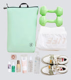 Collection of fitness and lifestyle items including a green bag, dumbbells, sneakers, and personal care products on a light gray background.