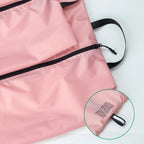 Pink shoe bag with a focus on a label on a white background