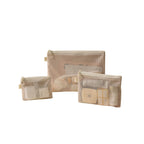 Set of three beige mesh pouches with various items on a white background