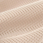 Close-up of beige textured fabric with a subtle pattern
