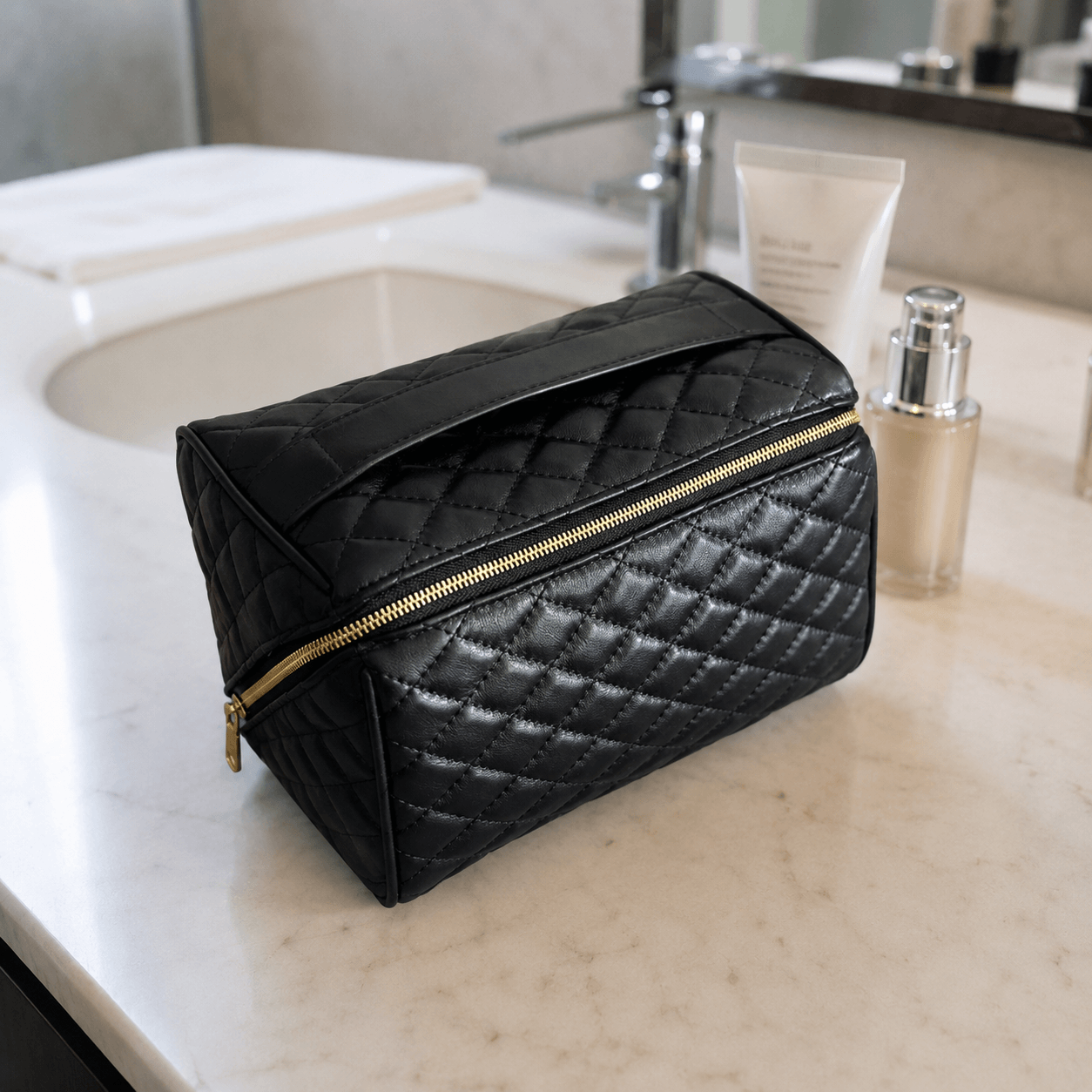 Black makeup bag on a bathroom counter with skincare products.